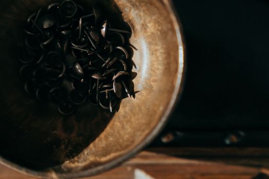 Black Coffee Beans in Brown Round Container