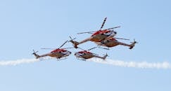 Red and White Helicopter Flying in the Sky