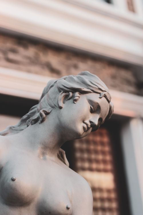 Free A close-up view of a detailed Renaissance stone sculpture in natural light. Stock Photo