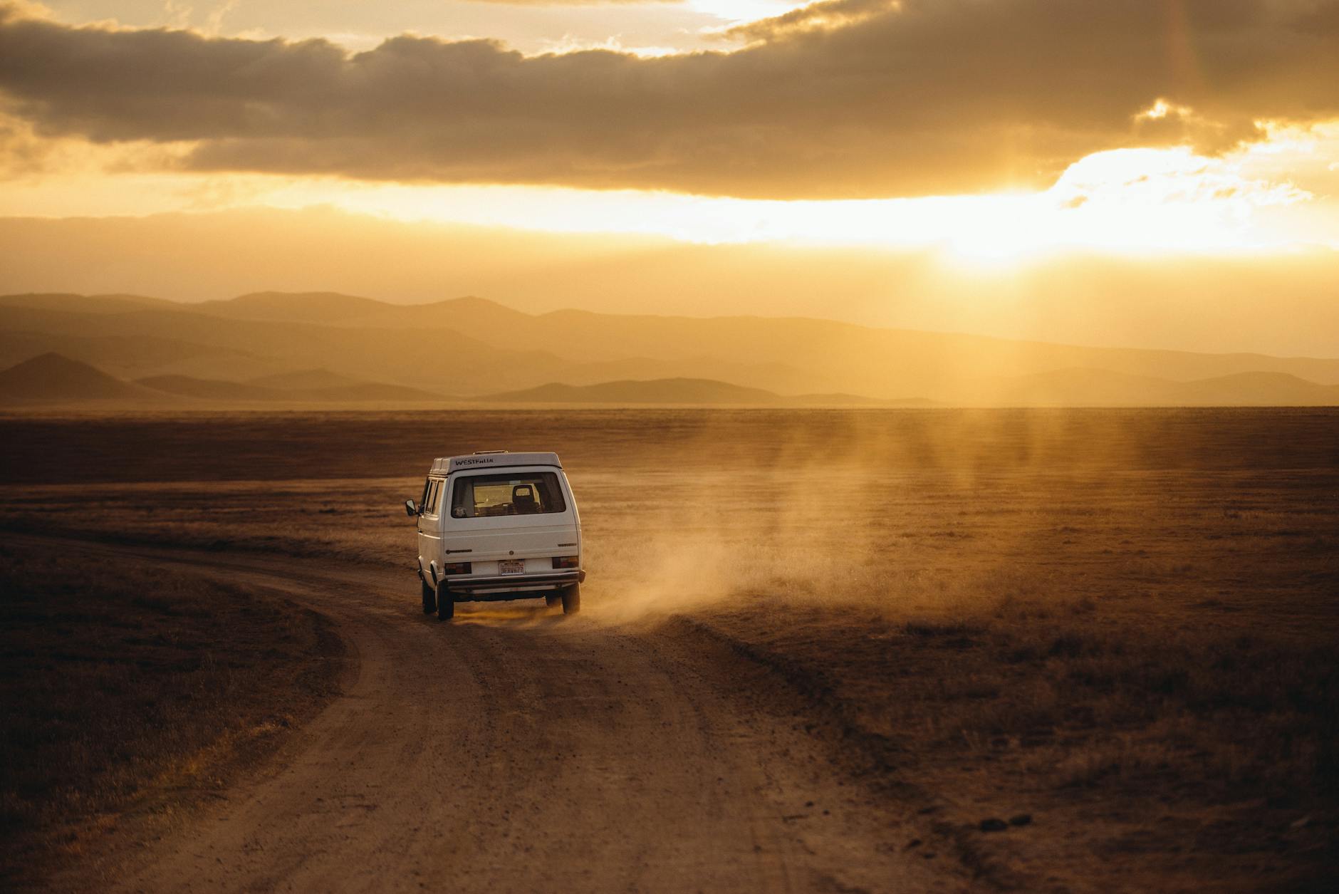 van driving off into the sunset