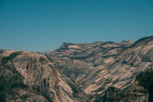 Breathtaking view of rugged cliffs and valleys in Yosemite National Park.