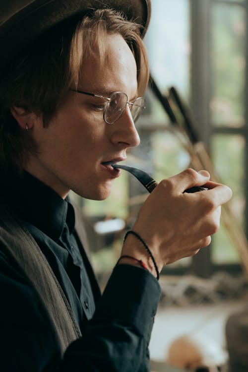 Man in Black Suit Jacket Smoking