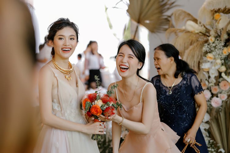 Happy Asian Bride With Friend On Wedding Celebration