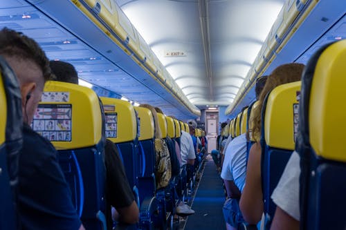 Free Passengers Seated on the Plane Stock Photo