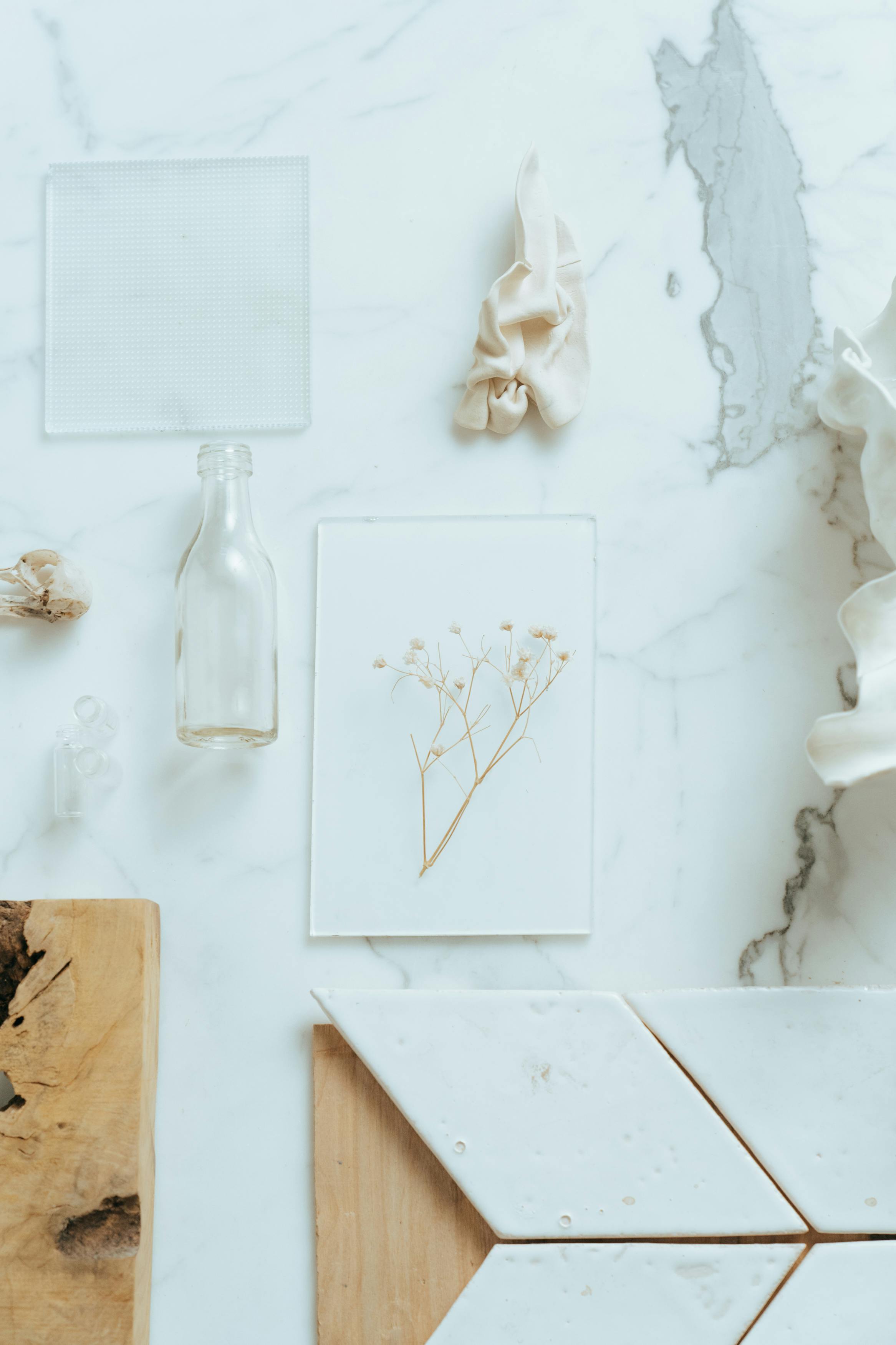 white ceramic angel figurine on white wooden table