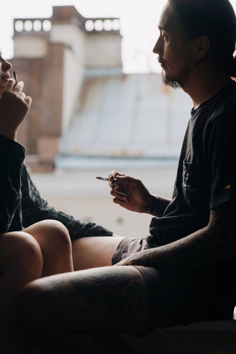 A Couple Smoking Cigarettes