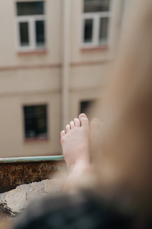 Free Barefoot leaning in a Rusty Metal  Stock Photo