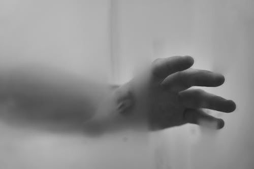 Free Grayscale Photo of a Hand Reaching Out Stock Photo