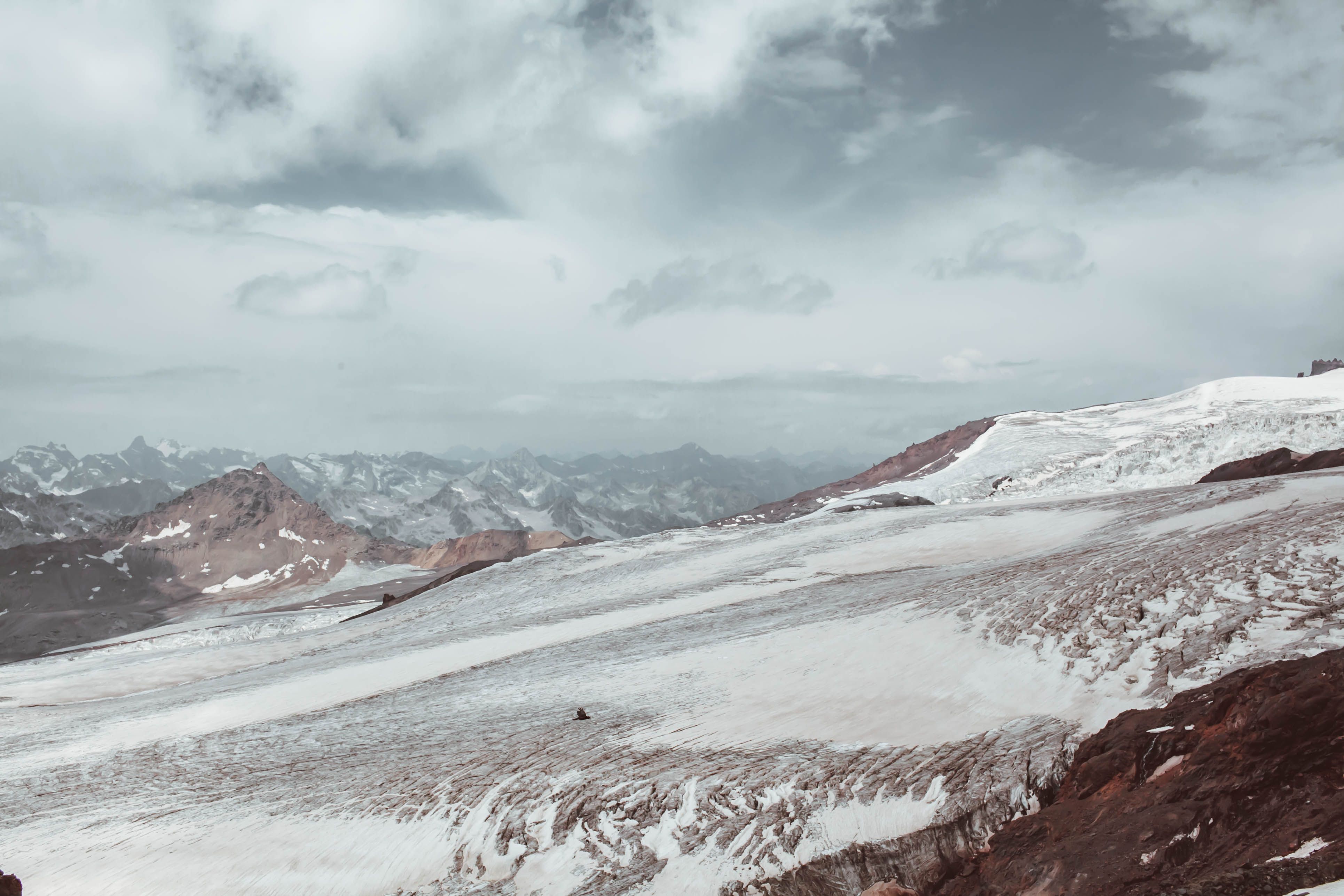 Mountainous ridge in snow on height · Free Stock Photo