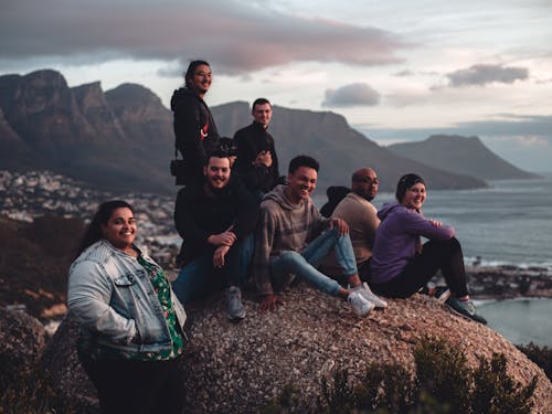 Group of tourists on rocky coast