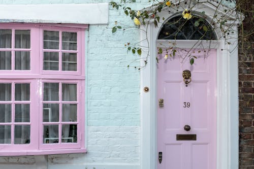 Free Door Knocker on Pink Door Stock Photo