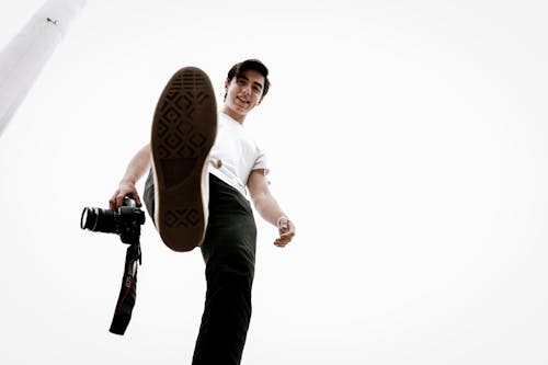 Free Good Looking Man Holding a Camera Stock Photo