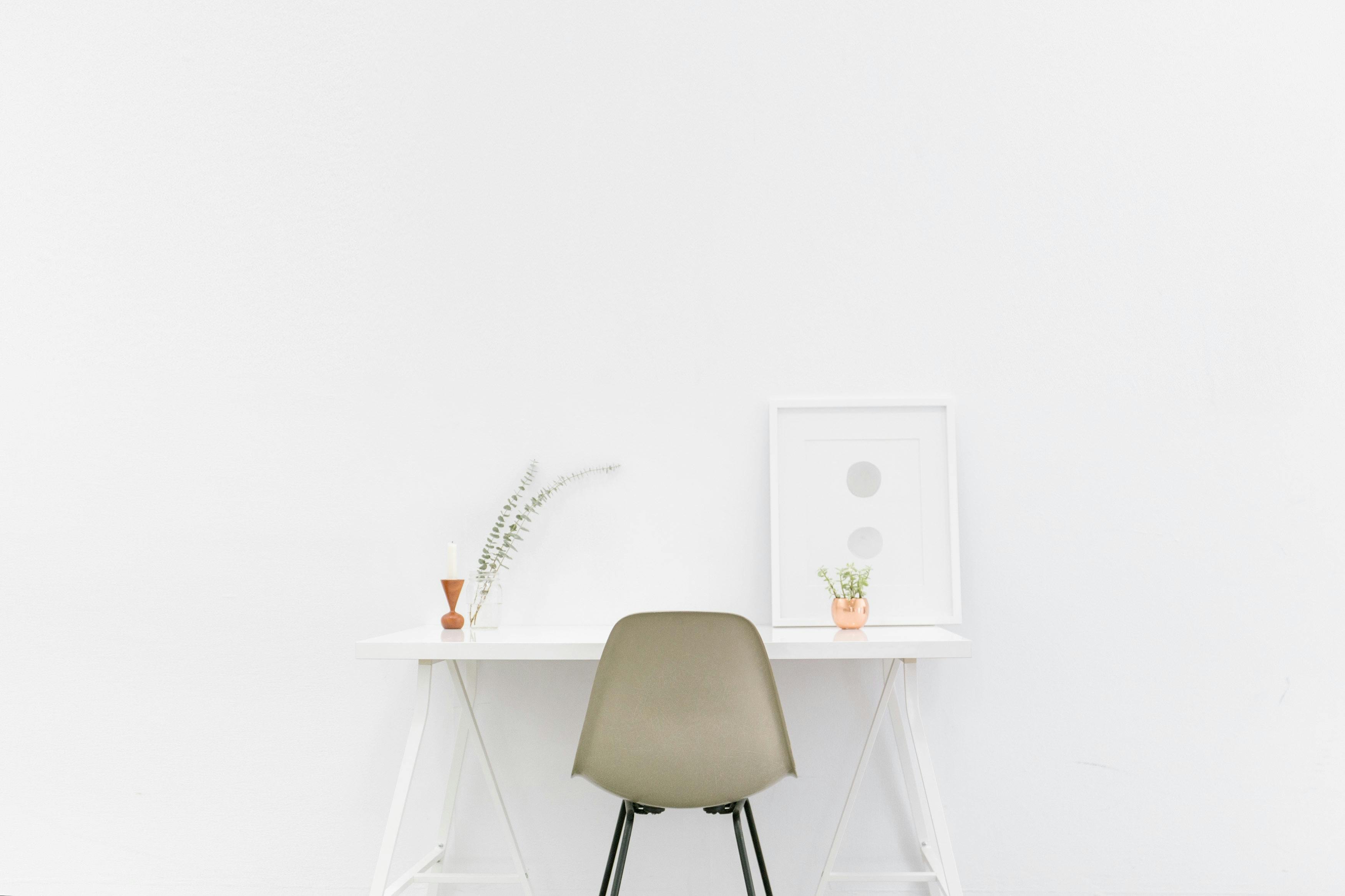 Beige and Black Chair in Front of White Desk