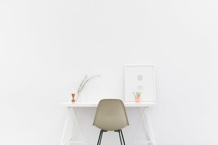 Beige And Black Chair In Front Of White Desk