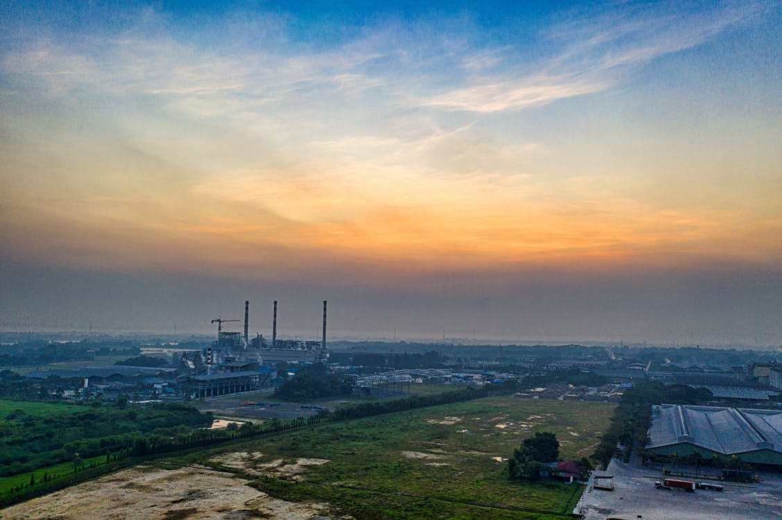 Drone Shot of an Industrial Area During Sunrise