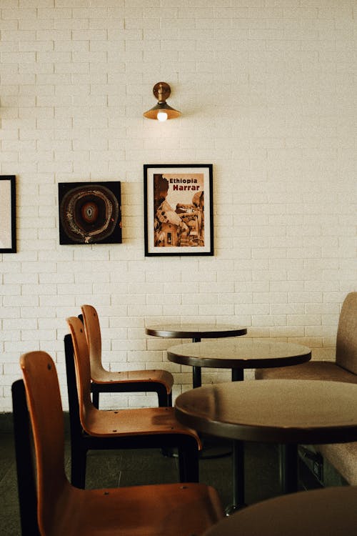 Frames Hanging on Brick Wall