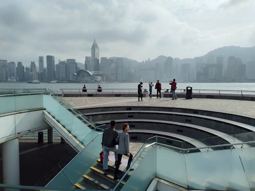 People Taking Photos of Hong Kong Victoria Harbour Near the Kowloon Public Pier 4 Ladder