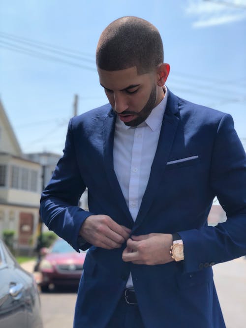 Good-Looking Man Buttoning His Blue Suit