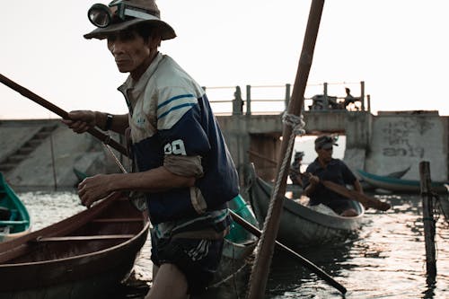 A Fisherman Pulling His Boat  to Shore