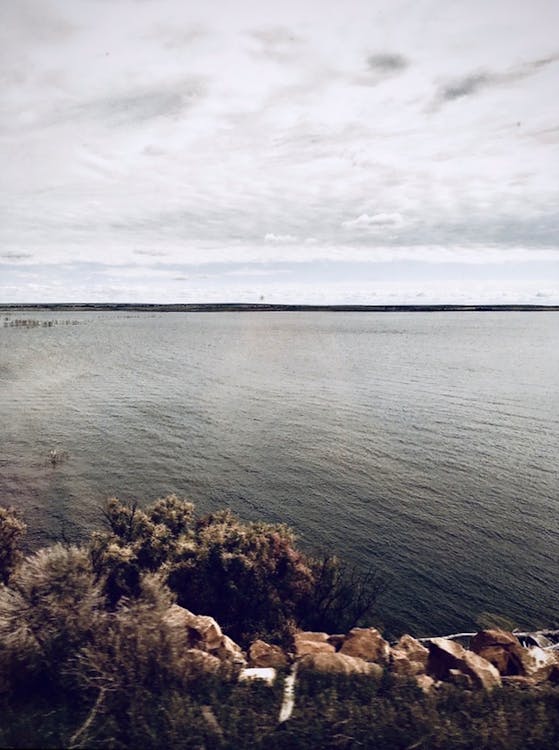 A Body of Water under a Cloudy Sky