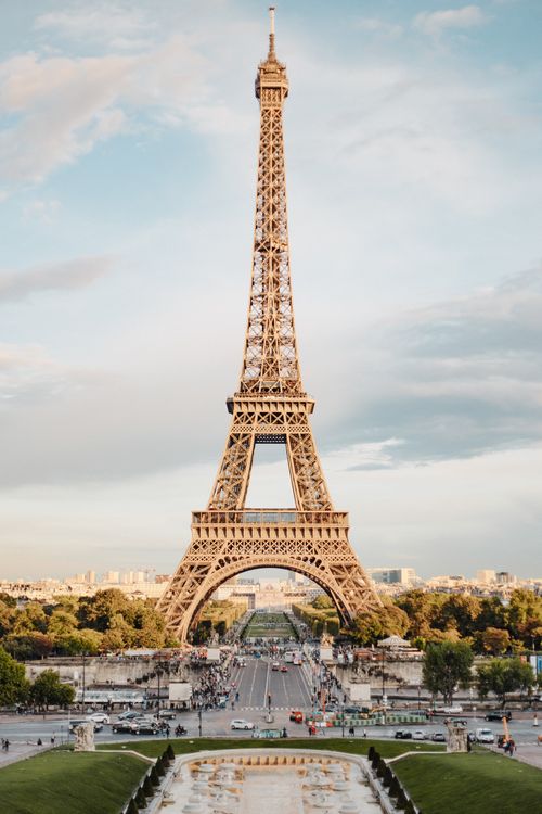 Free A stunning view of the Eiffel Tower in Paris, capturing its grandeur against a clear blue sky. Stock Photo