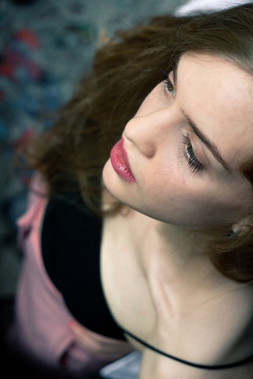 Free Artistic high angle shot of a woman with natural beauty and serene expression. Stock Photo
