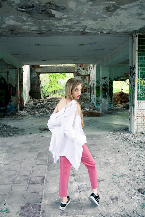 A Woman Inside an Abandoned Building