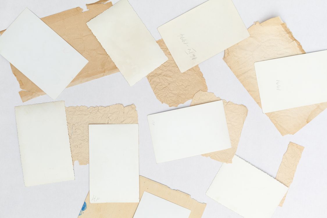 flat lay of vintage papers and blank cards ready to fold