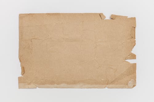 Free Brown Crumpled Paper Bag On Table Stock Photo