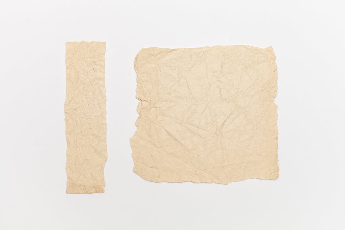 Brown Crumpled Paper On White Background