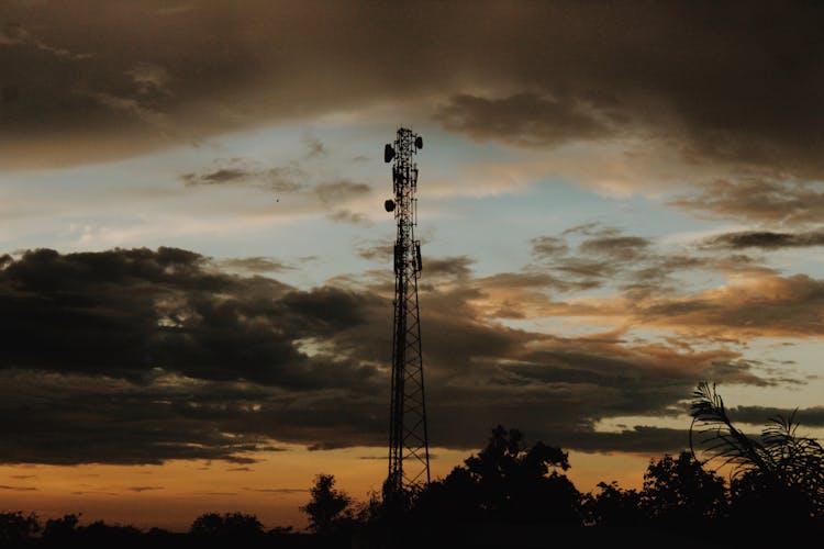 Silhouette Of A Satellite Tower During Sunset