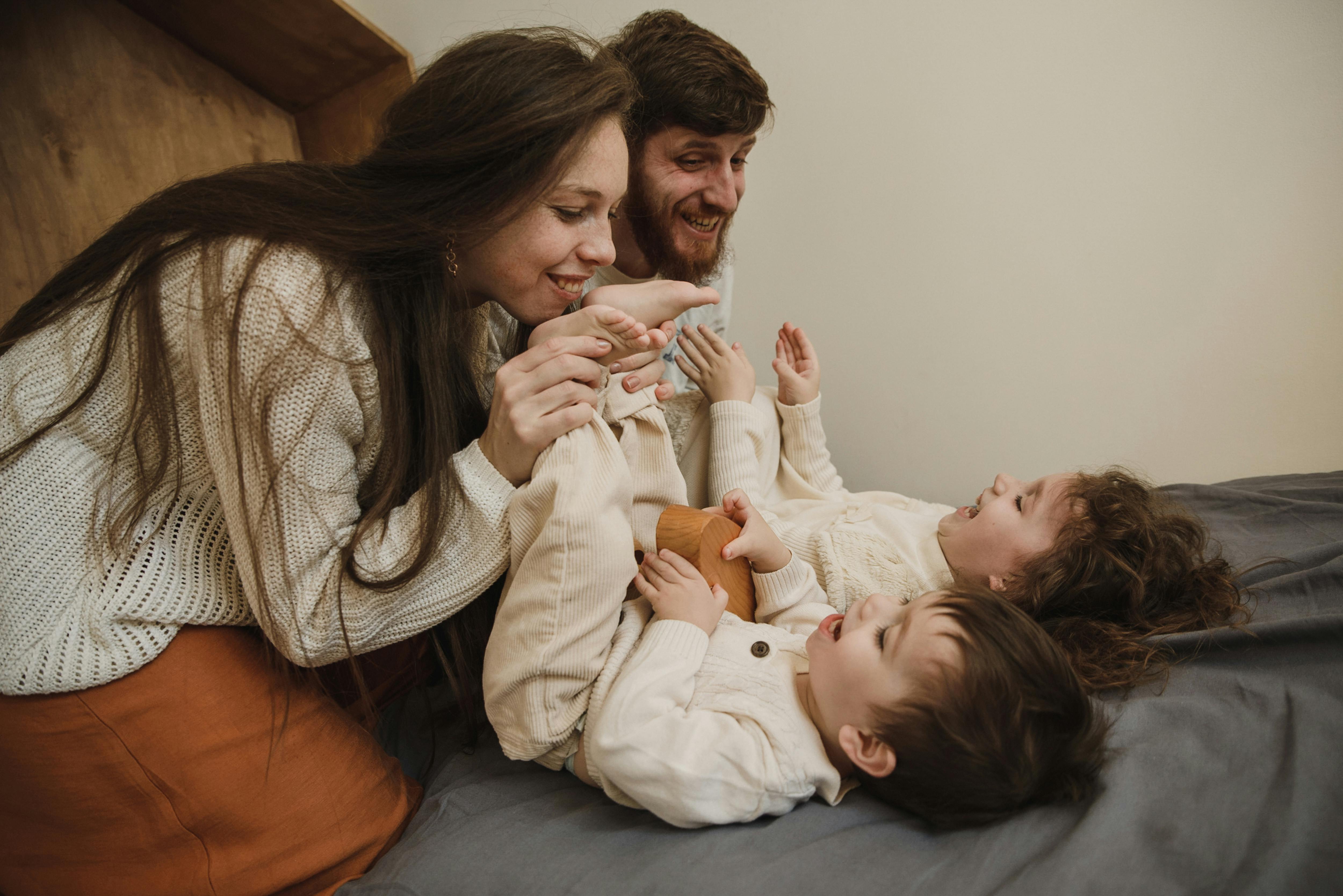 parents playing with their children