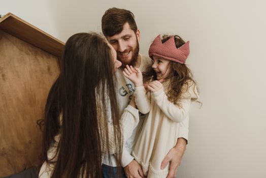 Happy Family Smiling at Each Other