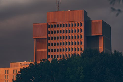 Brown Concrete Building Under Dark Sky
