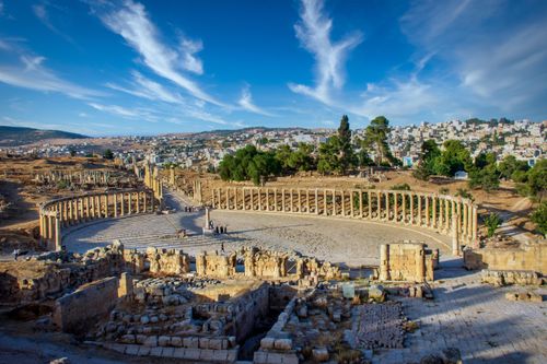 Free Explore the ancient Roman ruins of Jerash, Jordan, with stunning architectural details under a vibrant blue sky. Stock Photo