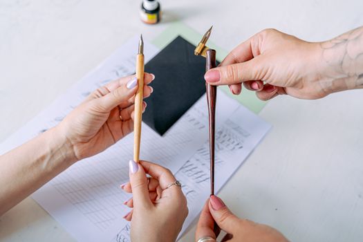 People Holding Nib Pens