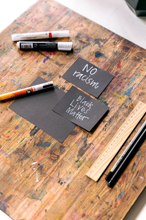 Free Activism Phrases on Black Cards Stock Photo