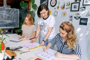 Instructor demonstrating lettering in a studio workshop — photo by Adventure Studio on Pexels