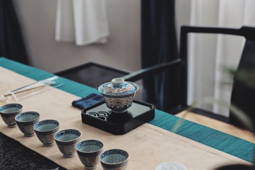 Free Decorative tea set with blue patterns arranged on a table with natural lighting. Ideal for lifestyle and culinary themes. Stock Photo
