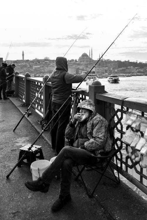 A Fisherman Smoking a Cigarette