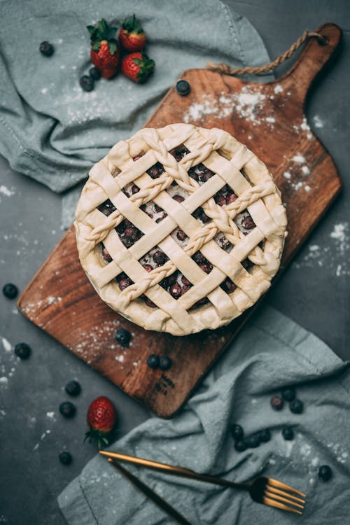 Photo Of Berry Pie On Top Of Wooden Chopping Board