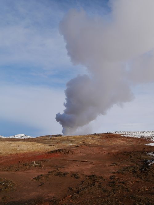 Free A geyser erupts under blue skies in Reykjanes, showcasing Iceland's breathtaking natural beauty. Stock Photo