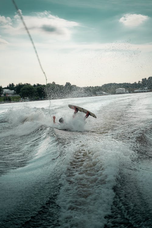 Free Person Water Skiing and Falling Stock Photo