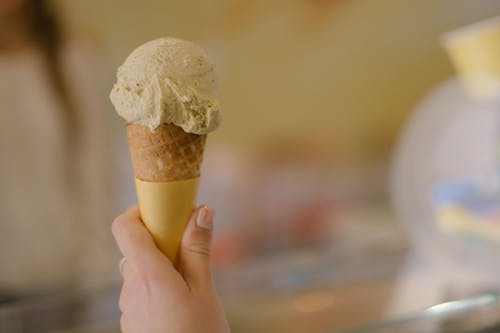 Close-Up Shot of a Person Holding an Ice Cream