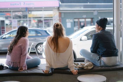 Free A group of friends enjoy a relaxed hangout in a city cafe in Perth, Australia. Stock Photo