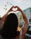 Photo Of Woman Doing Heart Shaped Hand Gestures