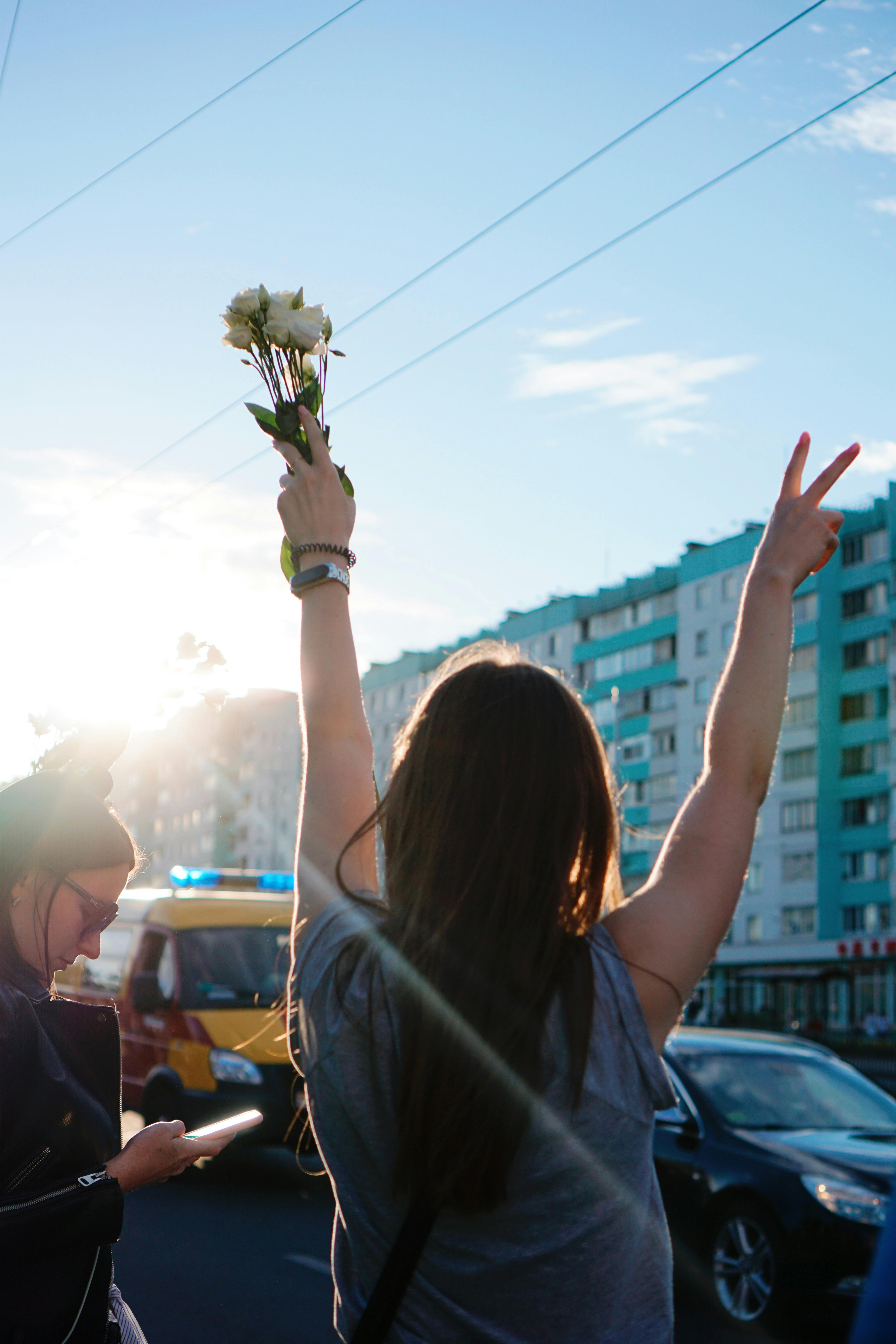 peaceful protester raising her hands