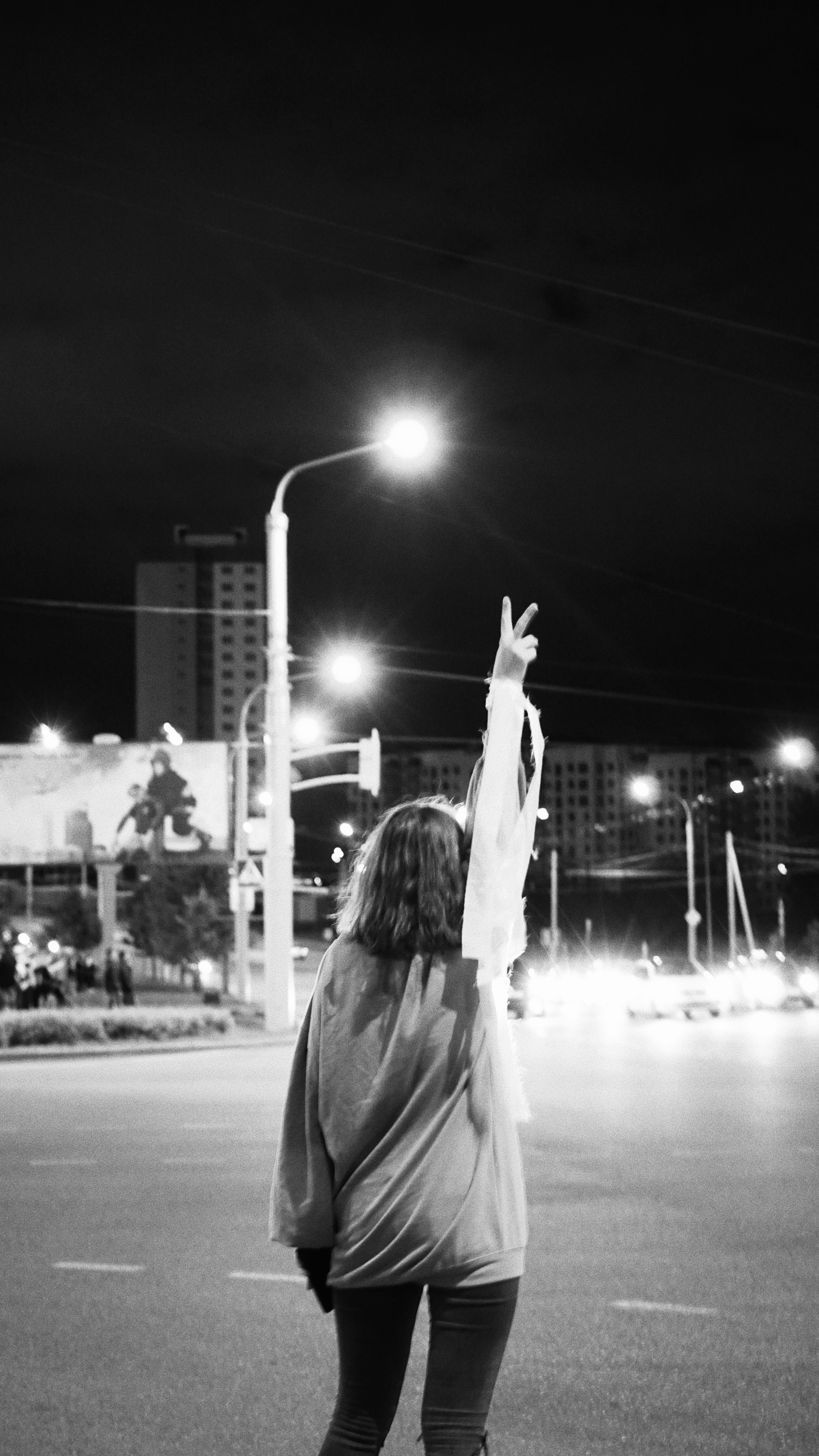 woman raising her hand