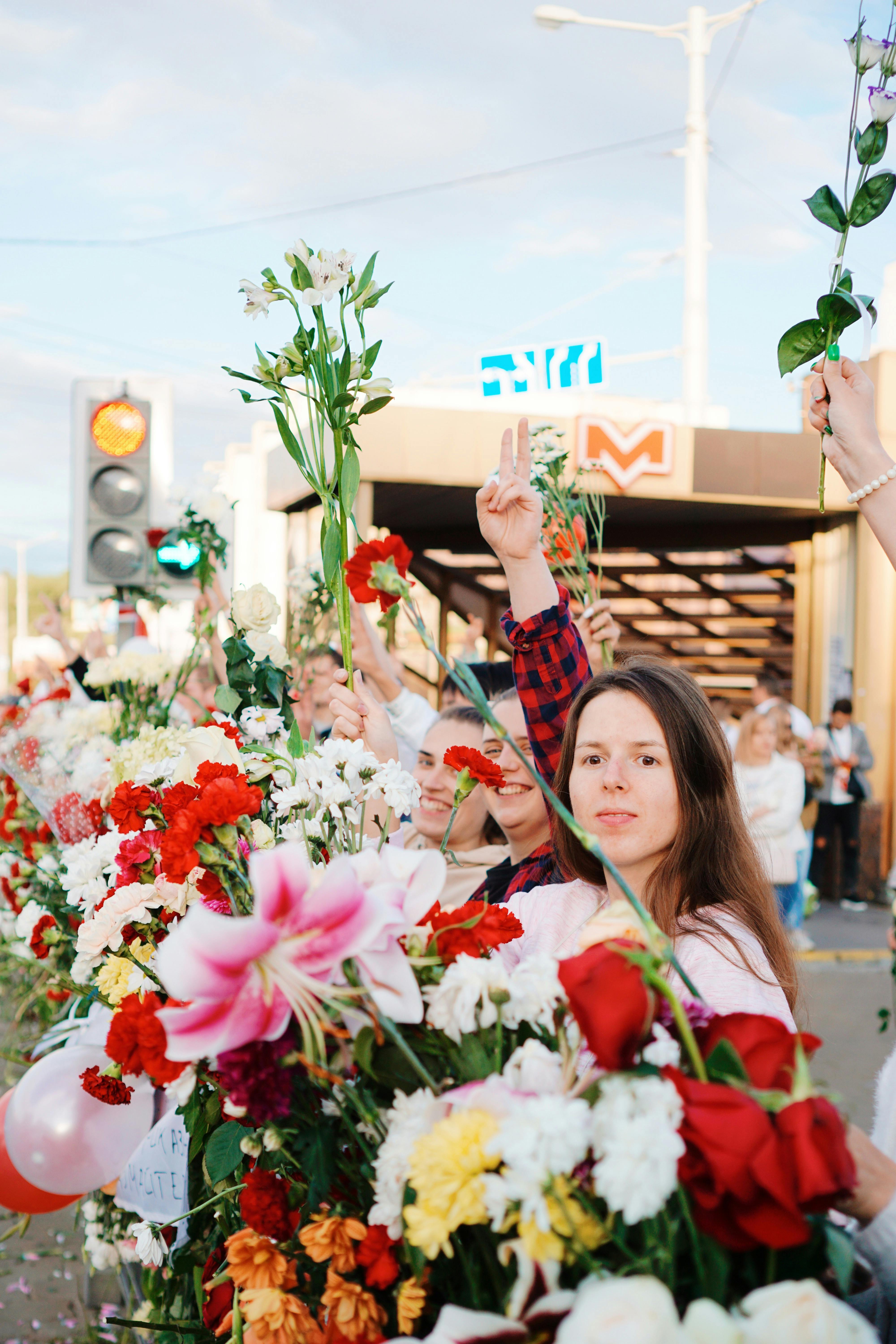 protesters holding flowers