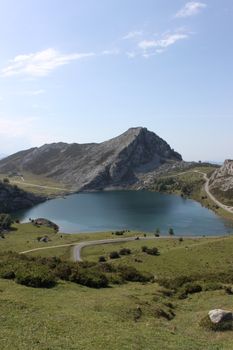 Beautiful landscape of a mountain lake in Asturias, Spain, under a clear sky.
